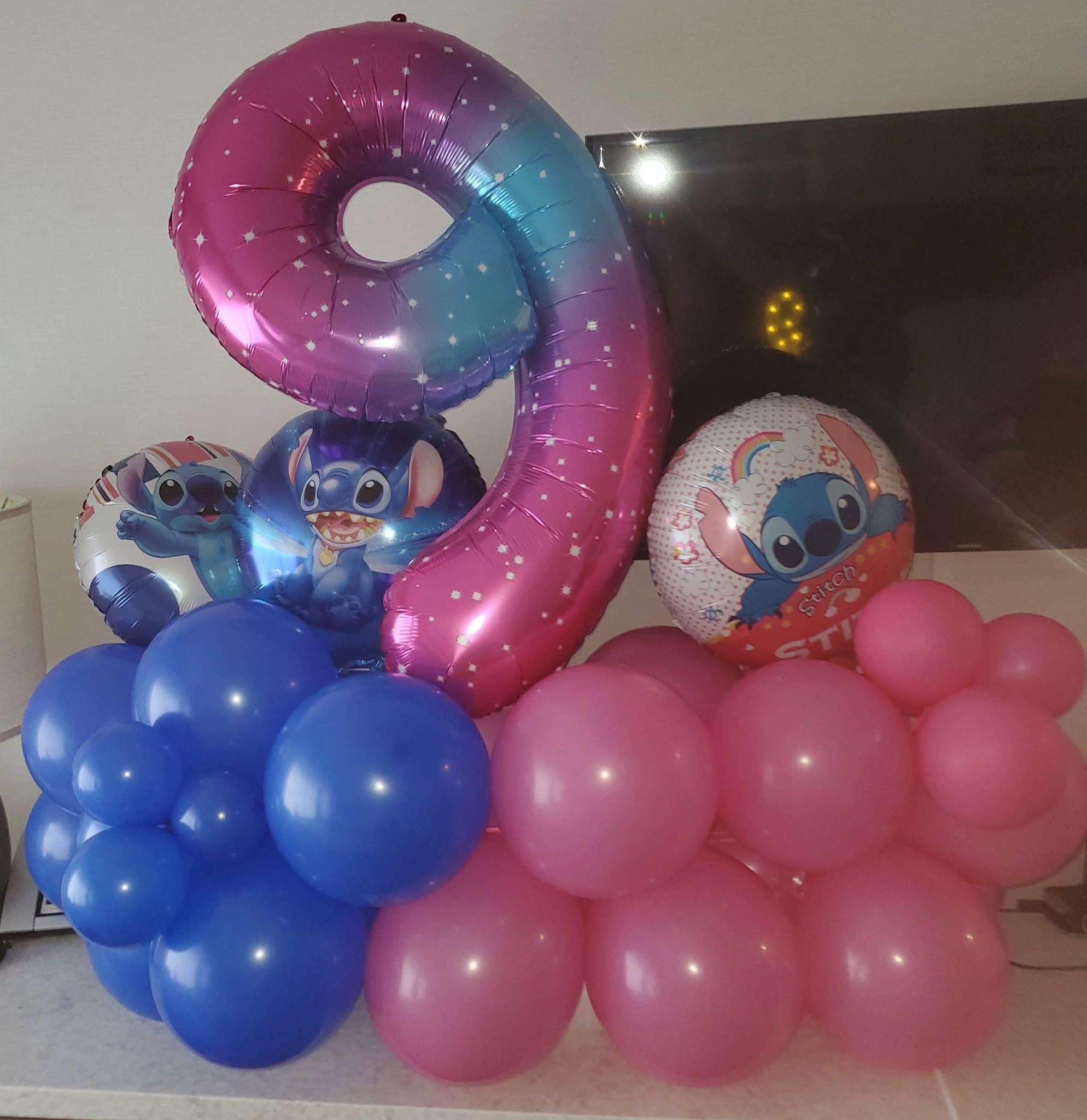 Pink and blue gradient number nine balloon with Stitch character foil and latex balloons.