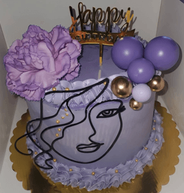 Purple birthday cake featuring a large flower, gold topper, and minimalist black line art face.